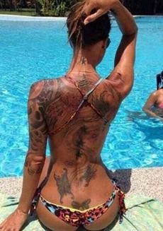 Tattoo babe at the pool